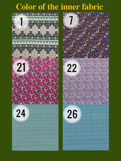 Fabric swatches with various patterns and colors on a green background